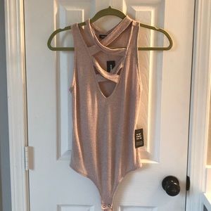 Pink cutout Express bodysuit. Size small. NWT